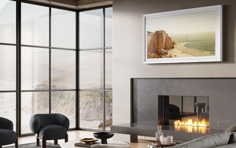 Close-up of a framed Sony TV installed above a modern fireplace