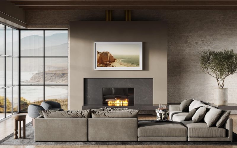 Sony BRAVIA TV displaying a vivid beach scene above a fireplace
