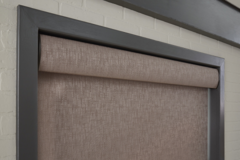 Close-up on Lutron motorized roller shades.