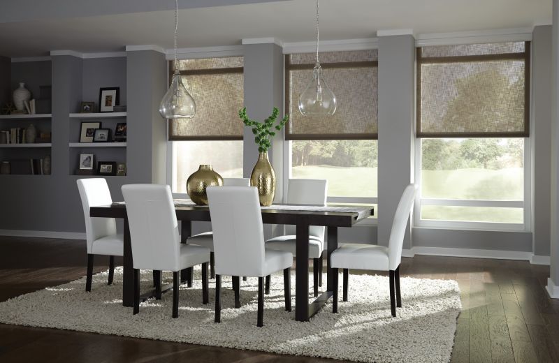 Designer dining room with Lutron motorized shades that complement the window design
